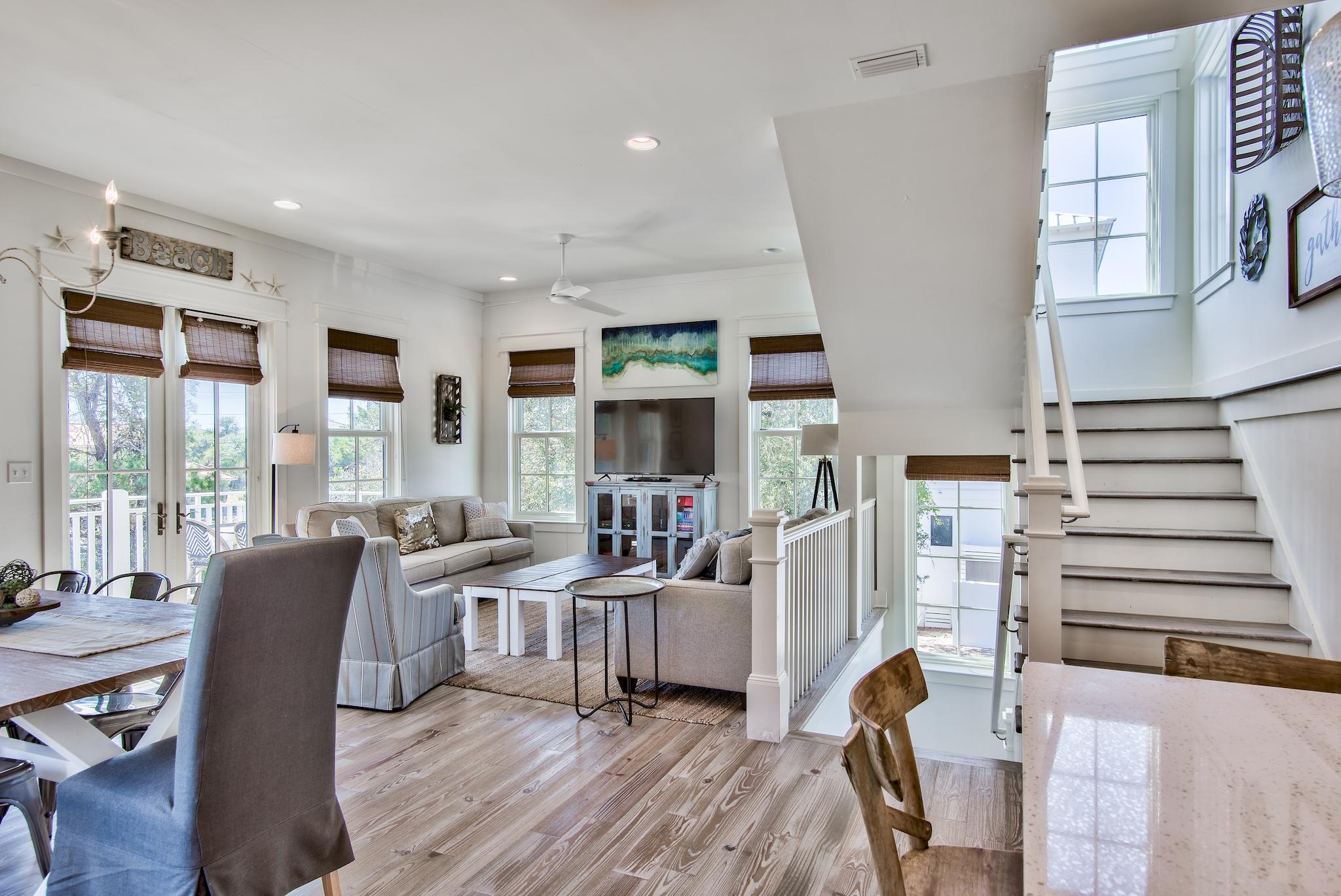 165 Sand Oaks Circle Santa Rosa Beach, FL 32459 - Photo 1 of 54 a living room with furniture and a floor to ceiling window