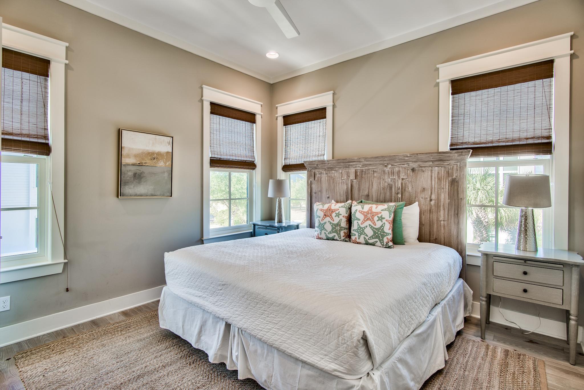 165 Sand Oaks Circle Santa Rosa Beach, FL 32459 - Photo 18 of 54 a bedroom with a large bed and a window