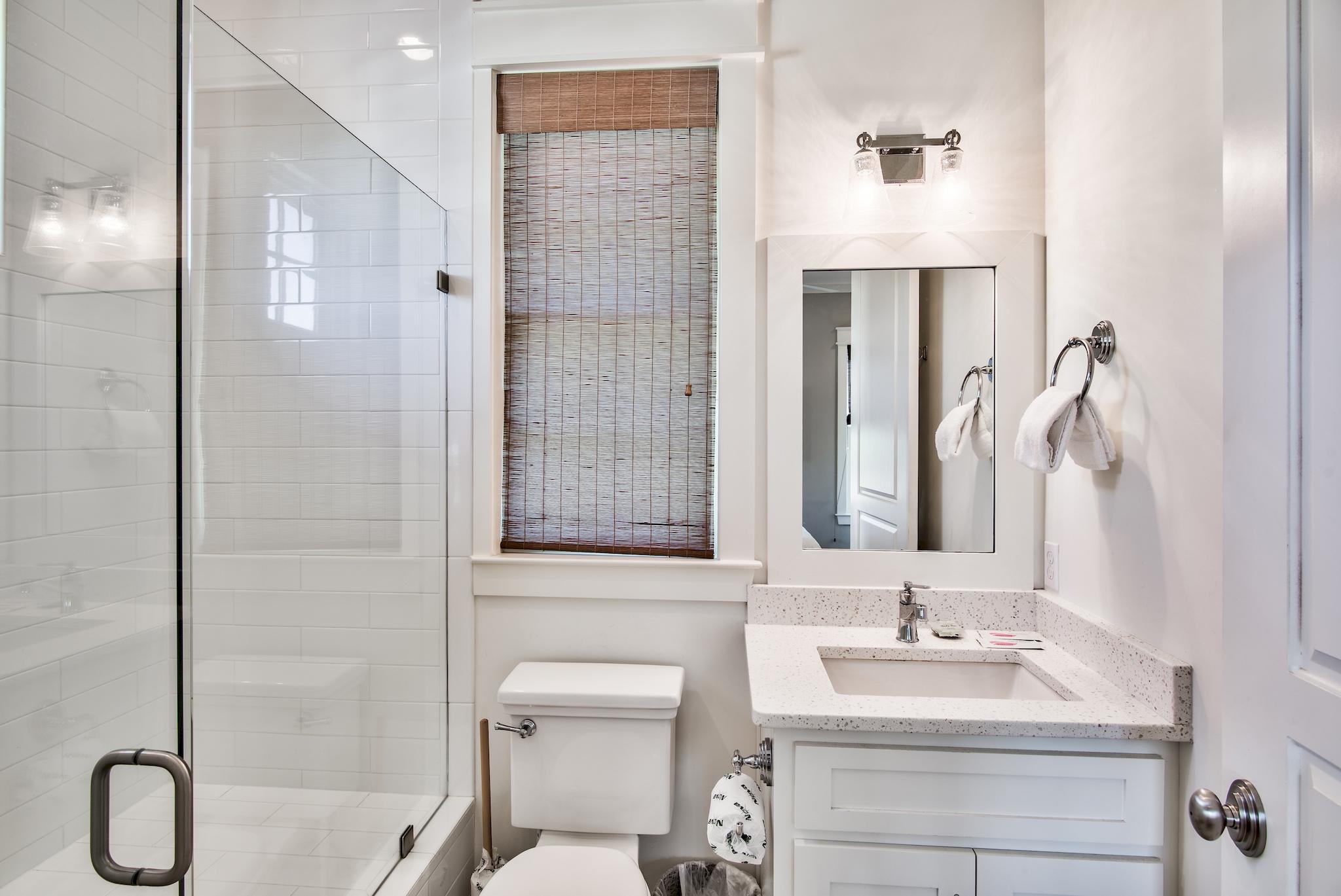 165 Sand Oaks Circle Santa Rosa Beach, FL 32459 - Photo 21 of 54 a bathroom with a double vanity sink a toilet and shower