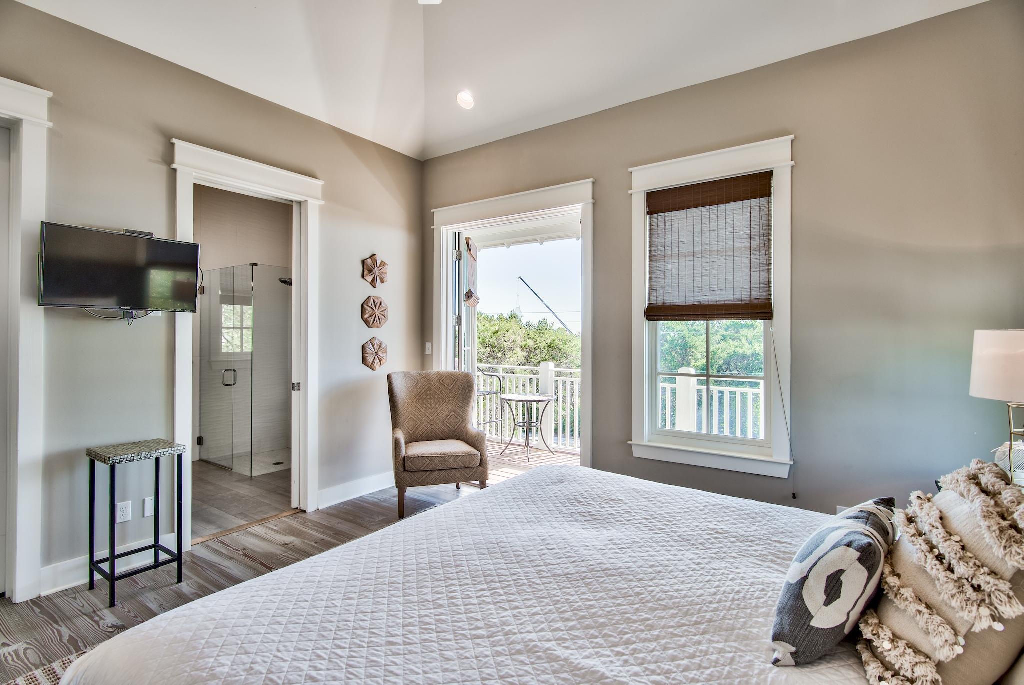 165 Sand Oaks Circle Santa Rosa Beach, FL 32459 - Photo 24 of 54 a bedroom with a bed and a chair with the outer view