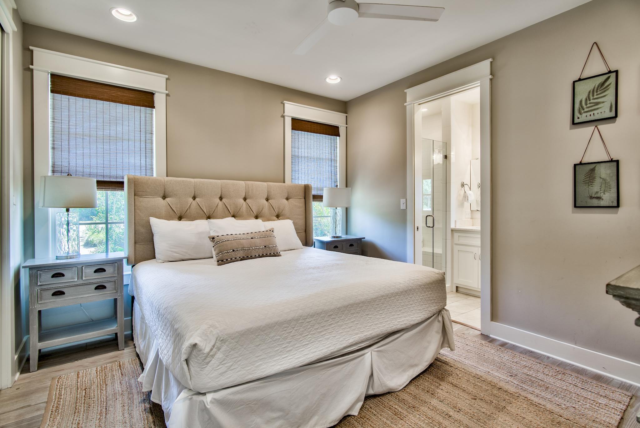 165 Sand Oaks Circle Santa Rosa Beach, FL 32459 - Photo 32 of 54 a bedroom with a bed a mirror and a window
