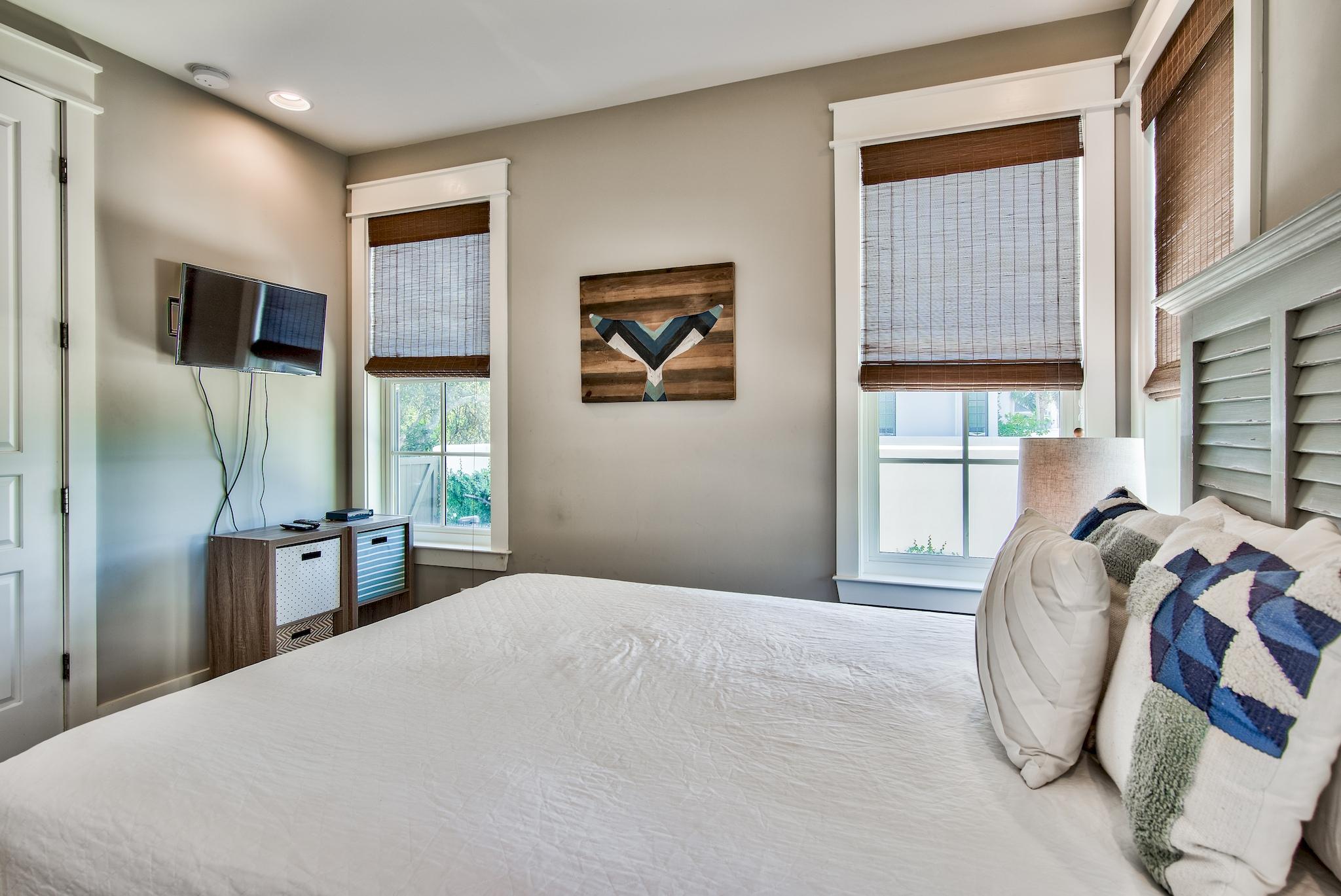 165 Sand Oaks Circle Santa Rosa Beach, FL 32459 - Photo 39 of 54 a bedroom with a large bed and a large window