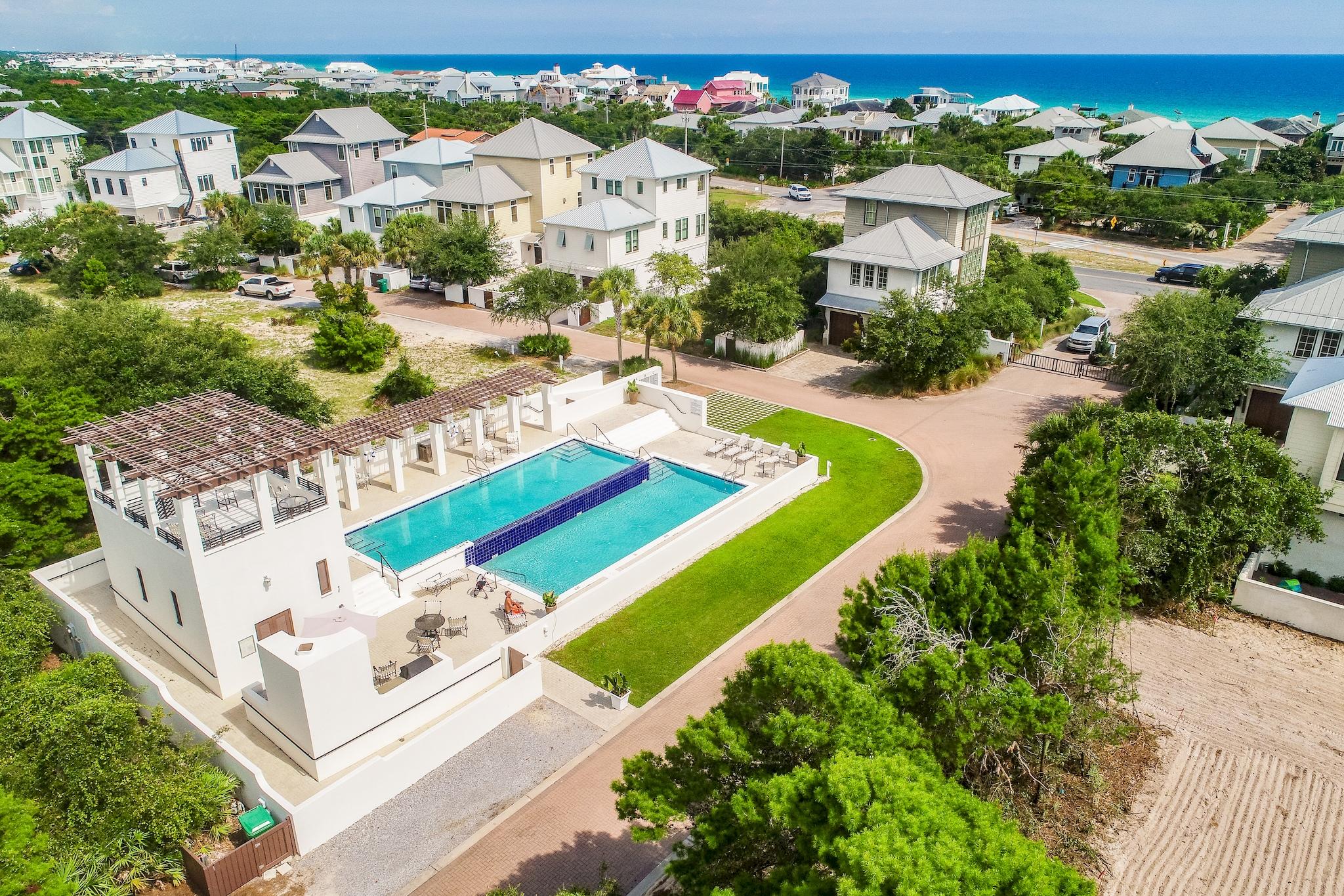 165 Sand Oaks Circle Santa Rosa Beach, FL 32459 - Photo 52 of 54 an aerial view of residential houses with outdoor space and parking