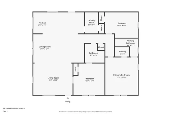 a view of a hallway with wooden floor and a bathroom