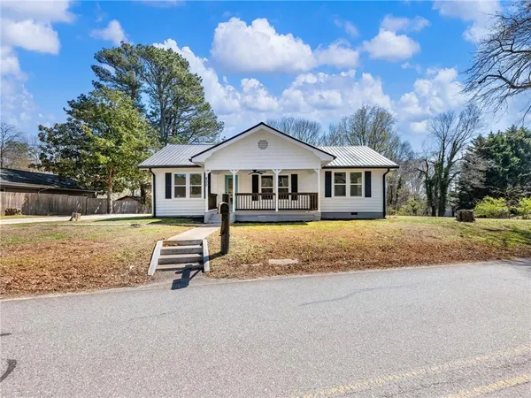 a view of swimming pool with outdoor seating