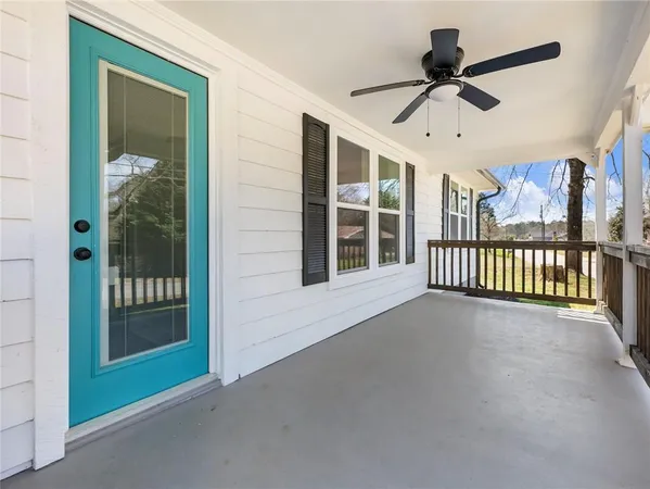 a view of a balcony with a ceiling fan