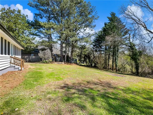 a view of a house with wooden fence