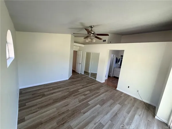 a view of a livingroom with wooden floor