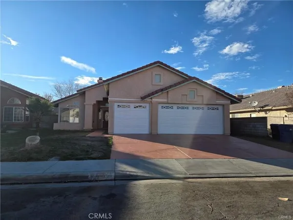 a front view of a house with yard