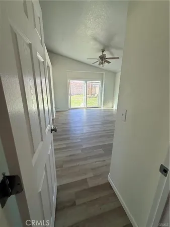 a view of a hallway view with wooden floor and staircase