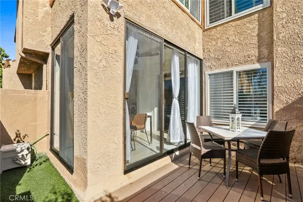 a view of balcony with two chairs and a table