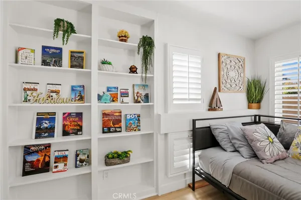 a living room with lots of furniture and a window