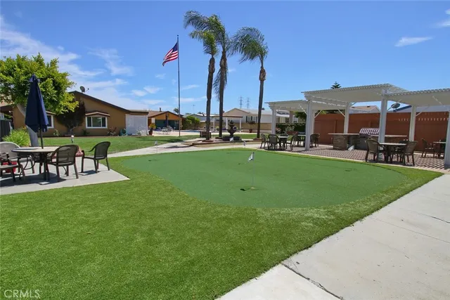 a view of a patio with table and chairs