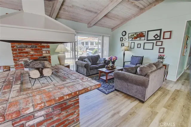 a view of a room with lots of wooden furniture