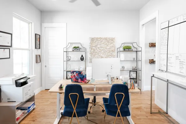 a workspace with furniture and window