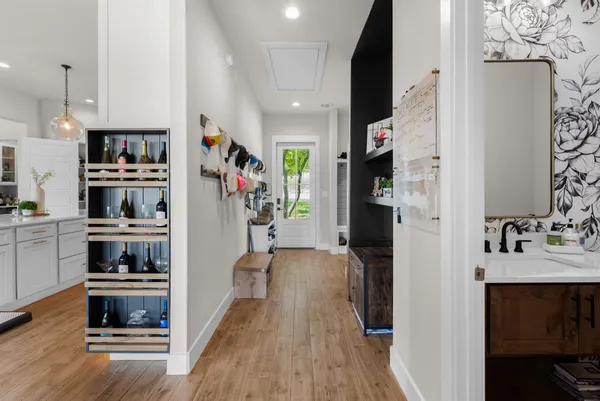 a kitchen with a refrigerator and a stove top oven