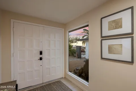 a view of a entryway door with wooden floor