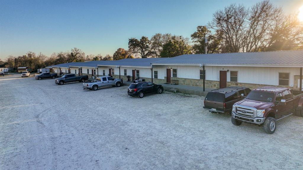 120 Bunkhouse Road Stephenville, TX 76401 - Photo 16 of 40 a view of a house with a yard and sitting area
