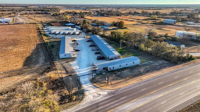 an aerial view of a house with a ocean view