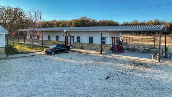 a view of a livingroom with furniture and a flat screen tv