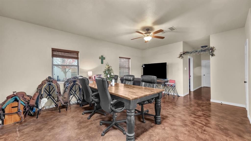 120 Bunkhouse Road Stephenville, TX 76401 - Photo 35 of 40 a view of a livingroom with furniture and a flat screen tv