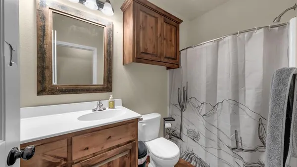a bathroom with a sink vanity and a mirror