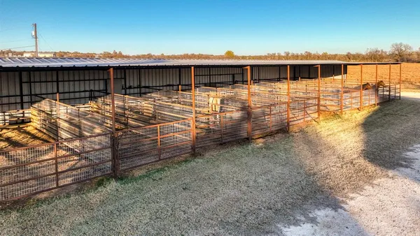 a view of a roof deck with wooden fence