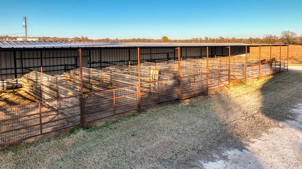 120 Bunkhouse Road Stephenville, TX 76401 - Photo 9 of 40 a view of a roof deck with wooden fence