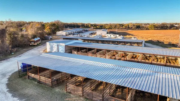 a view of a balcony with wooden floor and city view