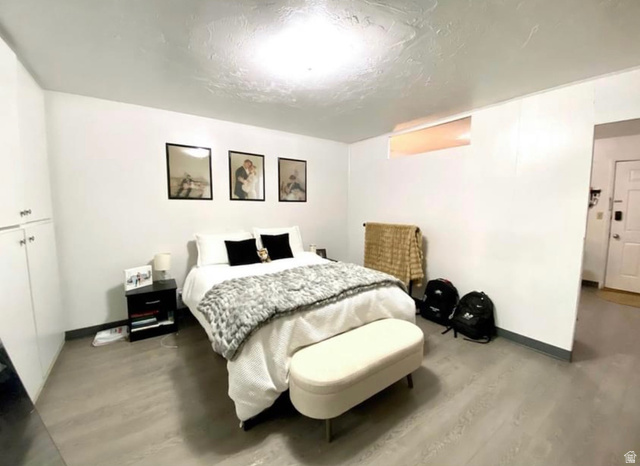640 East 600 North Logan, UT 84321 - Photo 11 of 20 Bedroom featuring wood finished floors and a textured ceiling