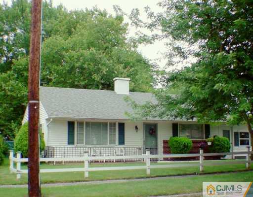 11 Raleigh Road Edison, NJ 08817 - Photo 1 of 2 front view of a house with a yard