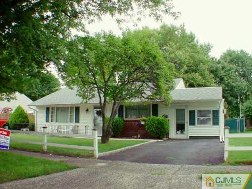 11 Raleigh Road Edison, NJ 08817 - Photo 2 of 2 a front view of a house with a yard