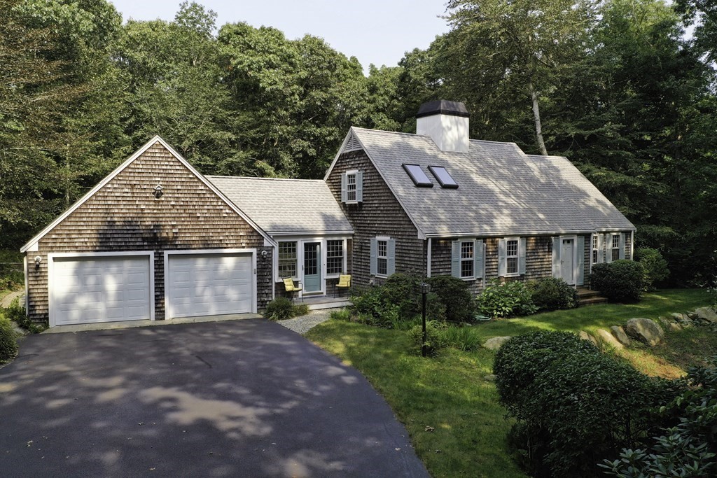 57 Two Ponds Road Falmouth, MA 02540 - Photo 1 of 42 a aerial view of a house next to a yard