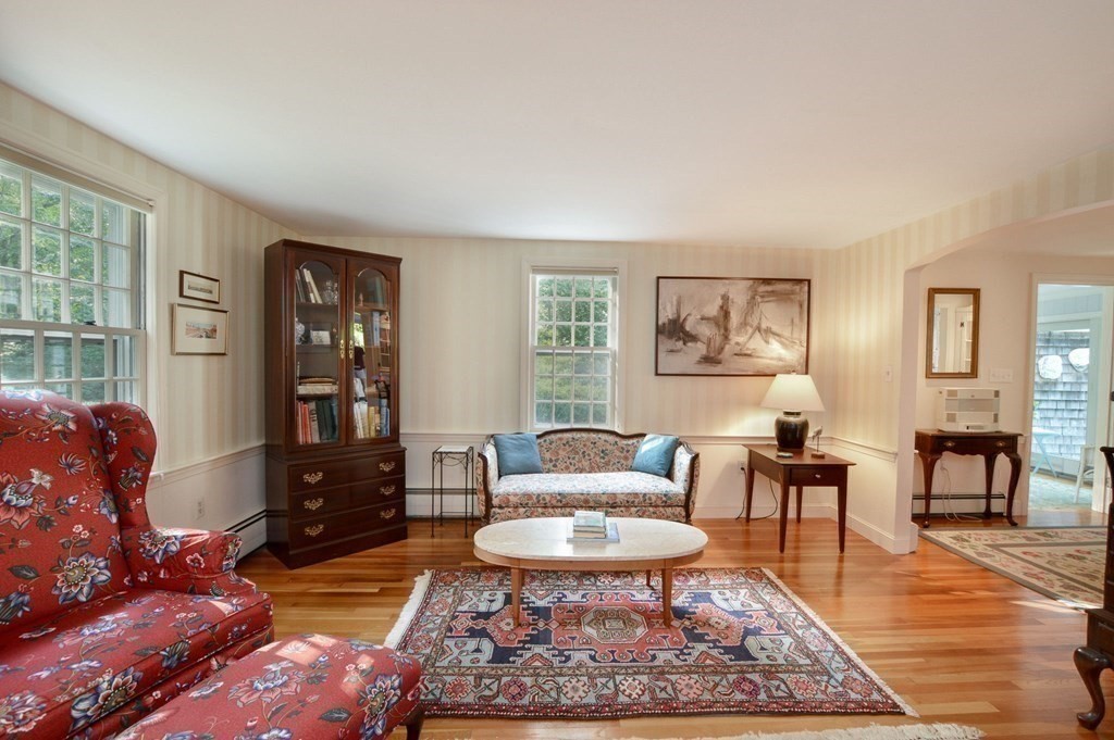 57 Two Ponds Road Falmouth, MA 02540 - Photo 12 of 42 a living room with furniture and a rug