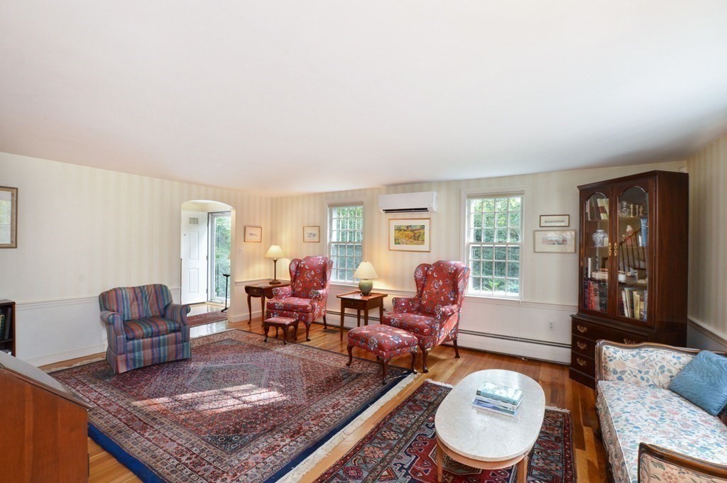 57 Two Ponds Road Falmouth, MA 02540 - Photo 13 of 42 a living room with furniture two window and a table