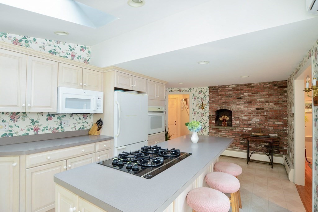 57 Two Ponds Road Falmouth, MA 02540 - Photo 14 of 42 a kitchen with a stove and a refrigerator
