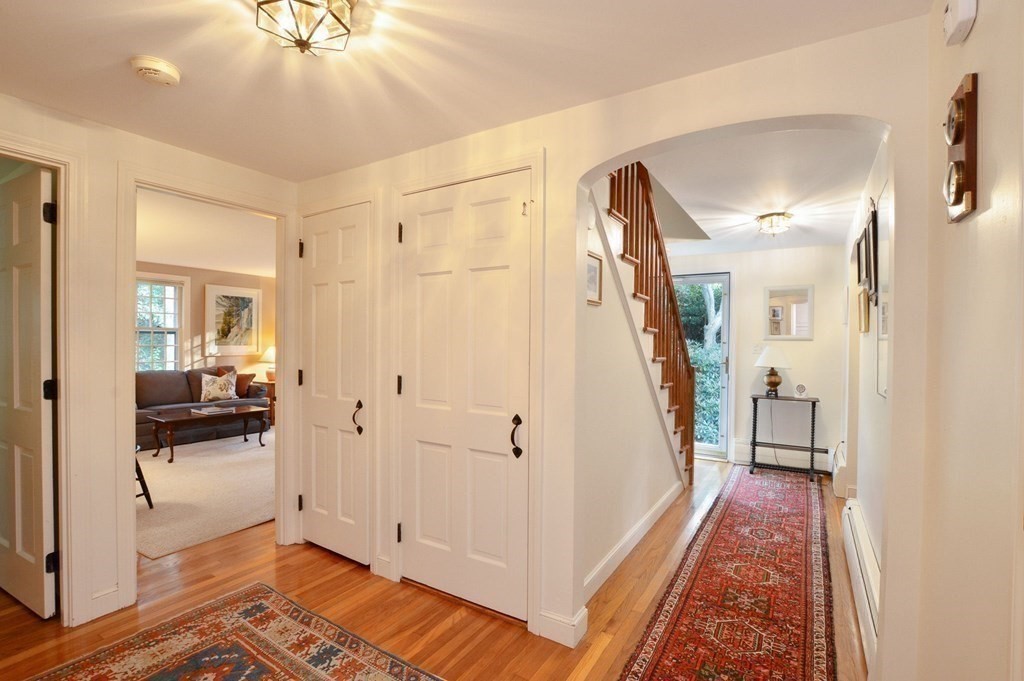 57 Two Ponds Road Falmouth, MA 02540 - Photo 18 of 42 a view of a hallway with a livingroom and a chandelier