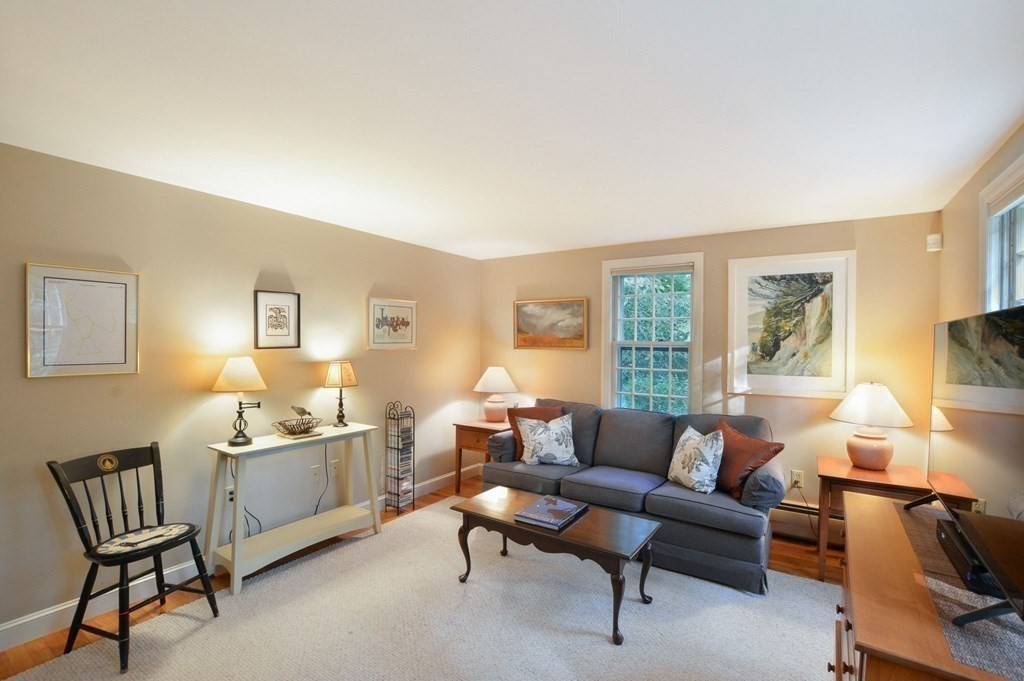 57 Two Ponds Road Falmouth, MA 02540 - Photo 20 of 42 a living room with furniture and a lamp