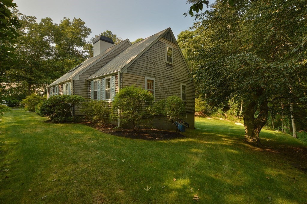 57 Two Ponds Road Falmouth, MA 02540 - Photo 2 of 42 a front view of house with yard and green space