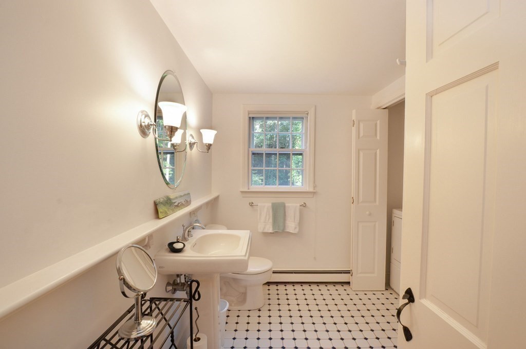 57 Two Ponds Road Falmouth, MA 02540 - Photo 22 of 42 a bathroom with a sink toilet and shower