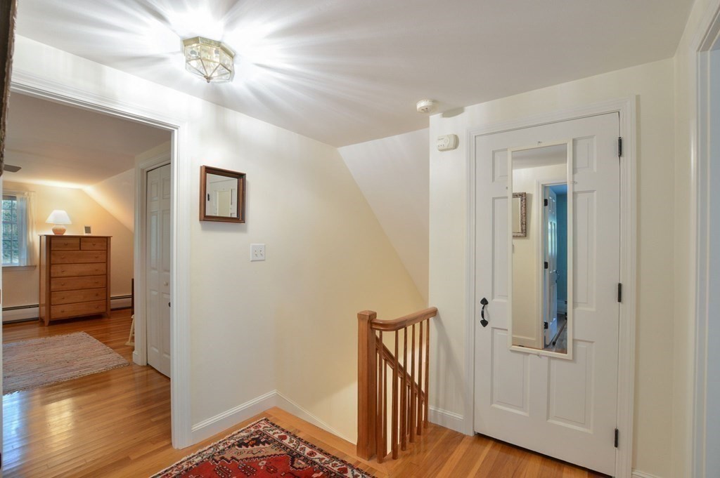 57 Two Ponds Road Falmouth, MA 02540 - Photo 29 of 42 a view of a hallway with wooden floor