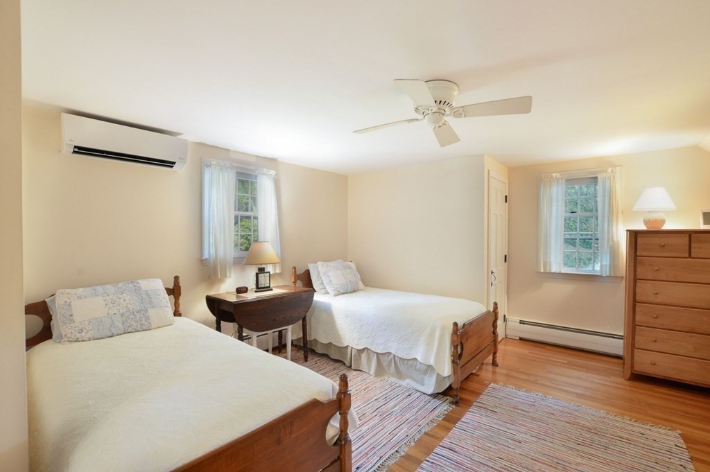 57 Two Ponds Road Falmouth, MA 02540 - Photo 31 of 42 a bedroom with two beds and wooden floor