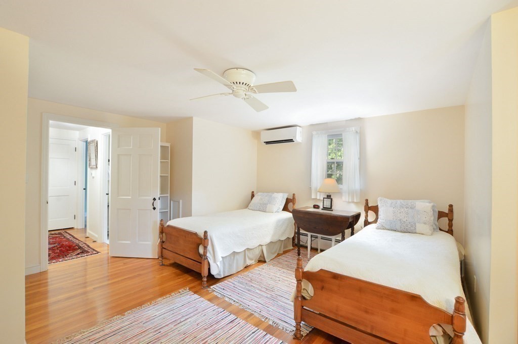 57 Two Ponds Road Falmouth, MA 02540 - Photo 32 of 42 a bedroom with two beds and painted walls