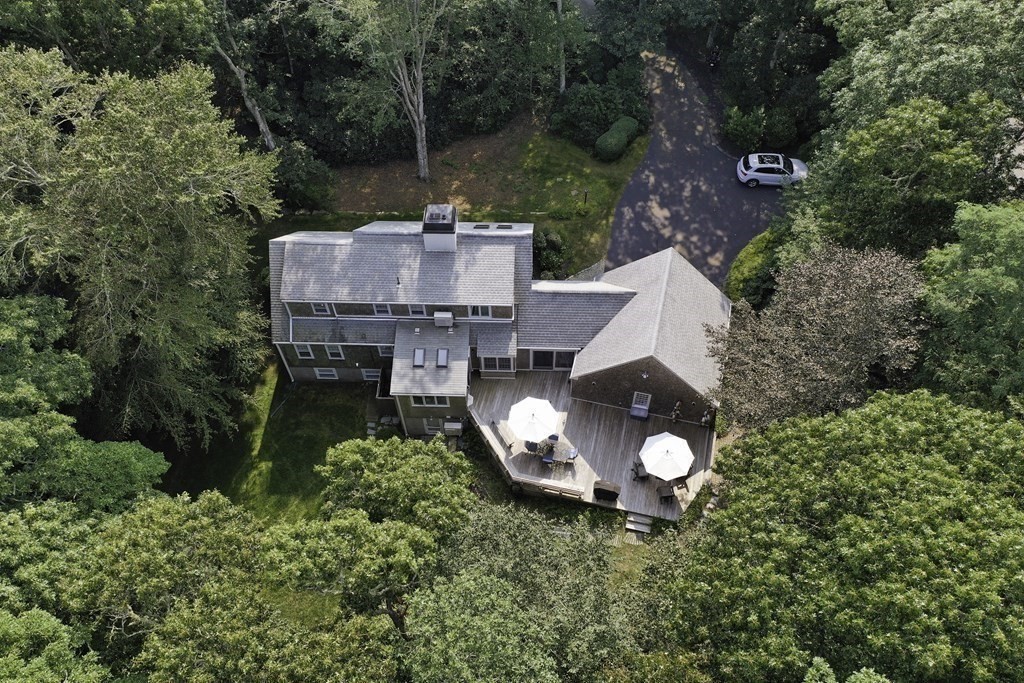 57 Two Ponds Road Falmouth, MA 02540 - Photo 37 of 42 an aerial view of a house with a yard and a large tree
