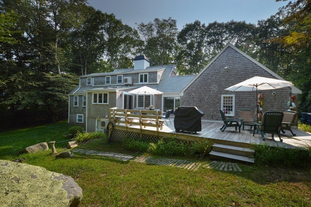 57 Two Ponds Road Falmouth, MA 02540 - Photo 4 of 42 a view of a house with backyard sitting area and garden