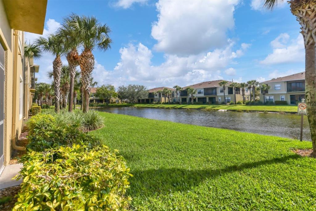 4174 Overture Circle, Unit 519 Bradenton, FL 34209 - Photo 15 of 53 a view of a lake with houses in the back