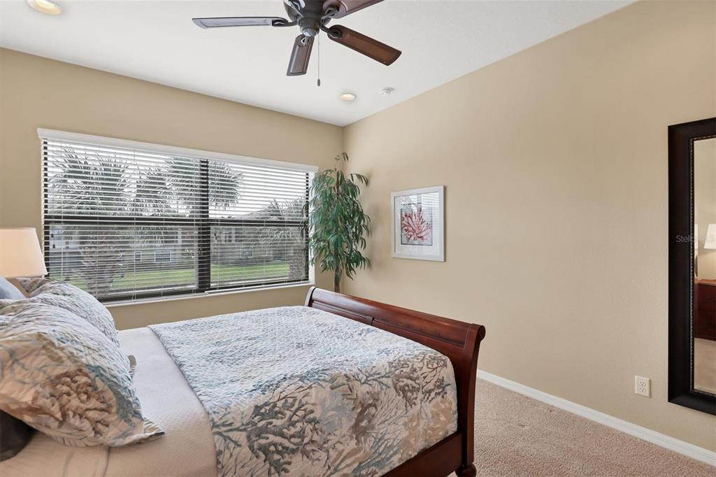 4174 Overture Circle, Unit 519 Bradenton, FL 34209 - Photo 26 of 53 a bedroom with a bed and a window