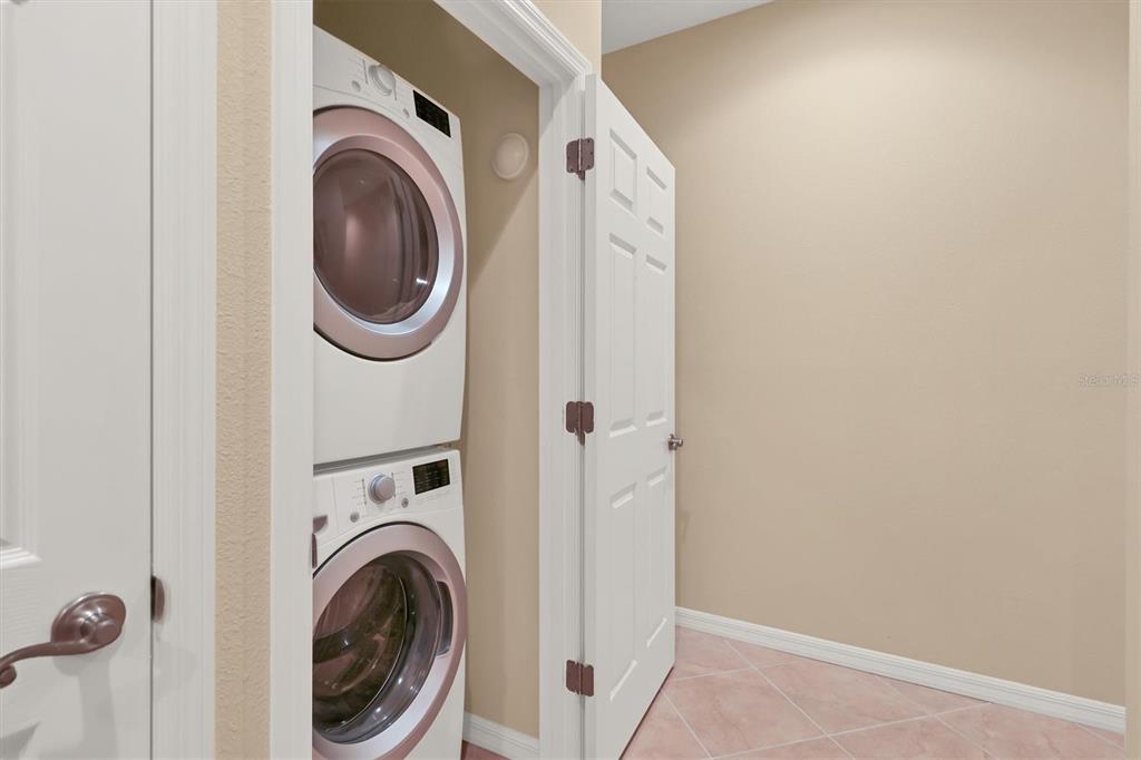 4174 Overture Circle, Unit 519 Bradenton, FL 34209 - Photo 33 of 53 a view of a hallway with washer and dryer