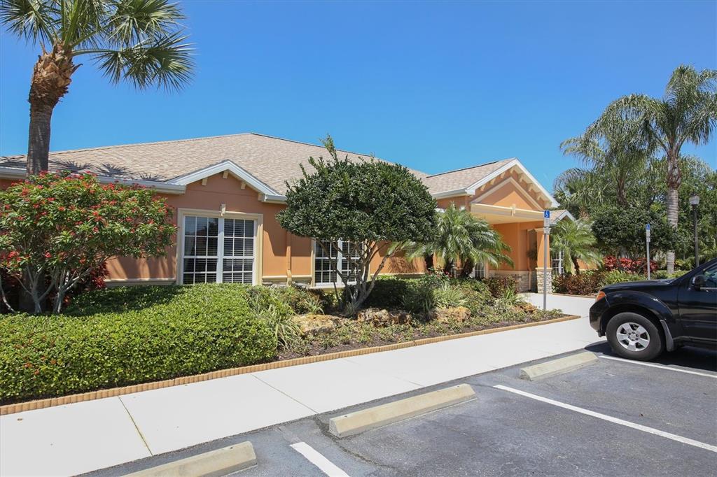 4174 Overture Circle, Unit 519 Bradenton, FL 34209 - Photo 42 of 53 a front view of a house with a garden