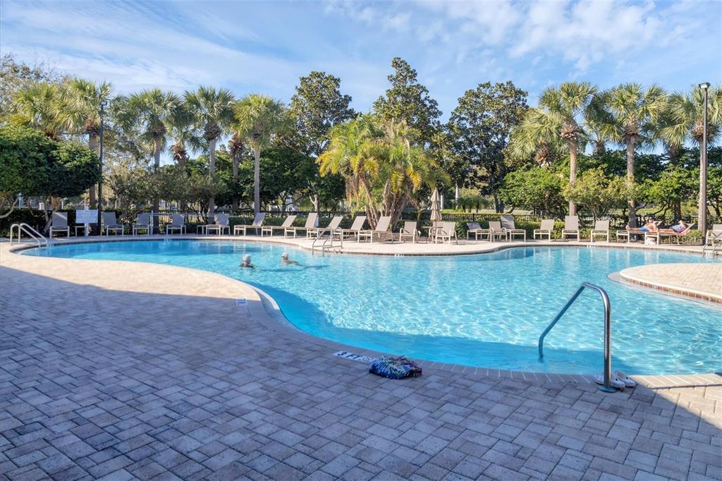 4174 Overture Circle, Unit 519 Bradenton, FL 34209 - Photo 50 of 53 a view of a swimming pool with outdoor seating and plants